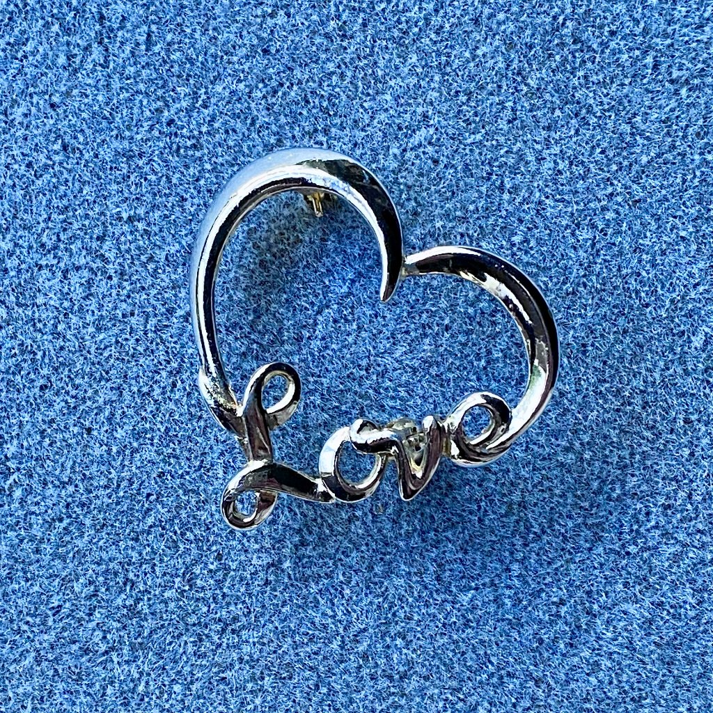 Vintage Silver Heart-Shaped Brooch With “Love” Incorporated Into The Design